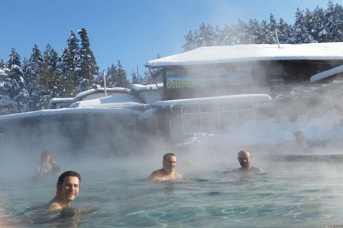 Seven Rila Lakes Snowshoe Hike and Thermal Baths Full-Day Tour from Sofia - A short pause beside a frozen lake